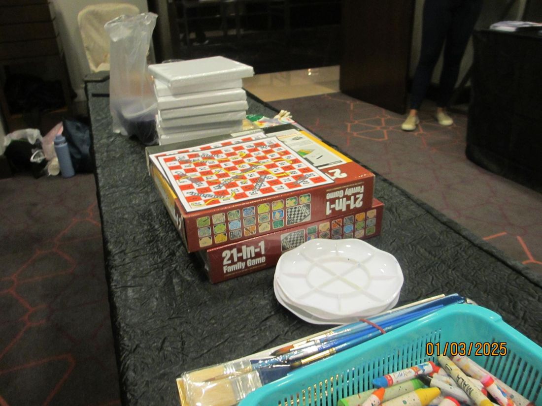 Board games and paper plates set out for a STEM x Games workshop