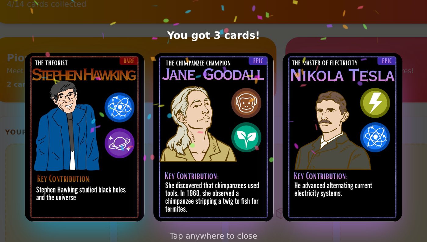 Opening a pack of STEM-hero cards: Stephen Hawking, Jane Goodall and Nikola Tesla